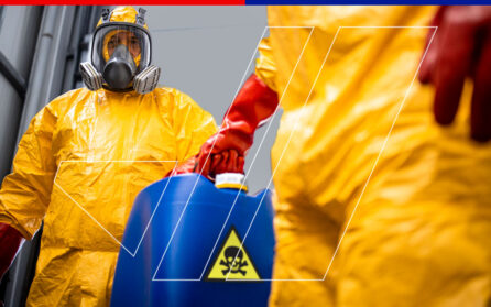 two men in hazmat suits carrying a dangerous product