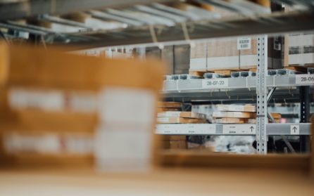 Warehouse shelves stacked with packages and boxes