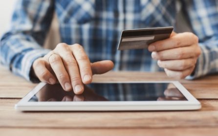 man entering credit car information